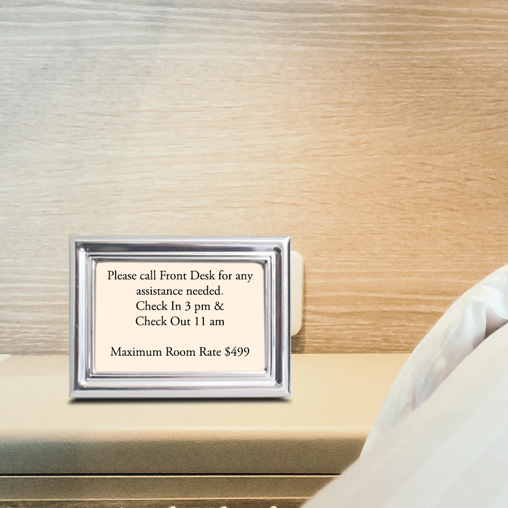 A Royal Silver Small Frame on a hotel nightstand with Room Rate Information inserted