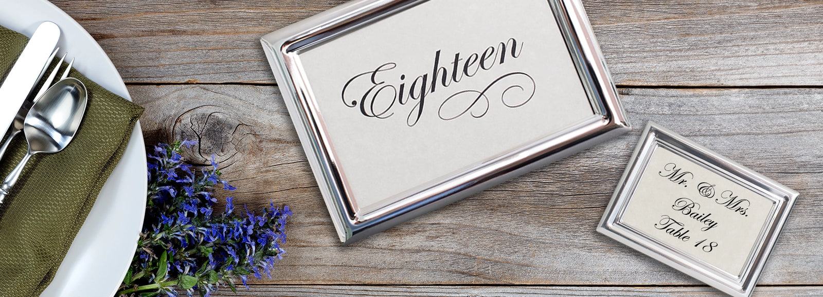 Tudor Silver Table Number frame and a Royal Silver Place Card frame on a table