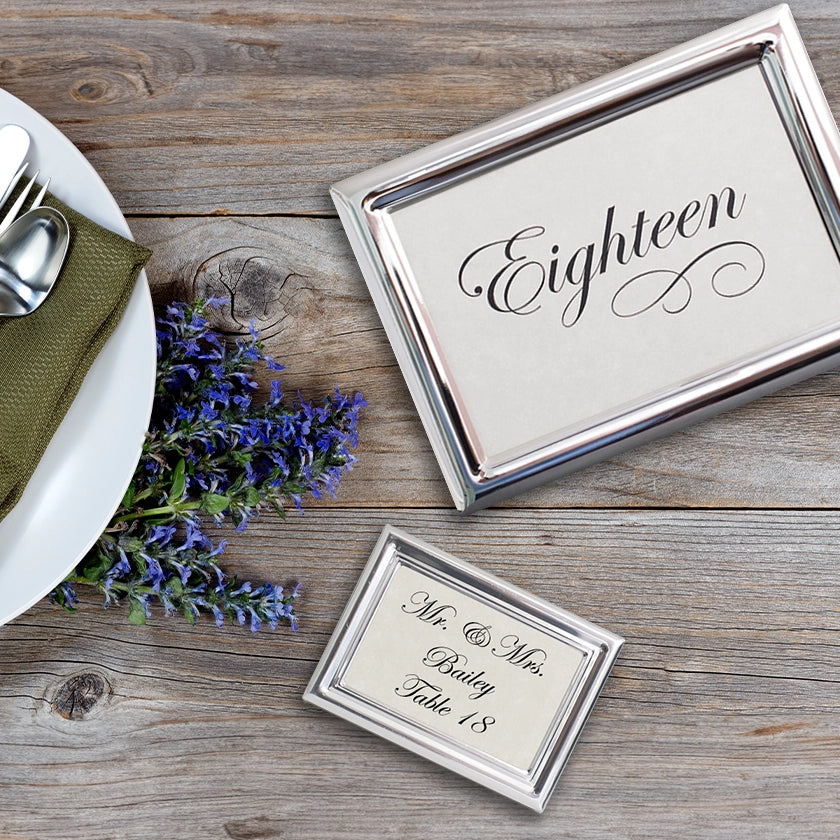 Tudor Silver Table Number frame and a Royal Silver Place Card frame on a table