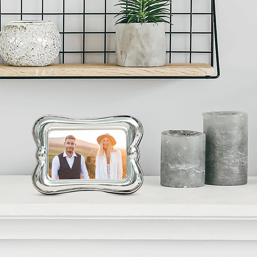 A Imperial Silver Small Frame on a table