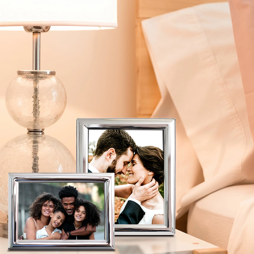 2 Tudor Silver Frames on a nightstand